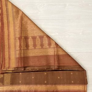 An elegant Tan Gold saree - perfect for party wear or festival celebrations!